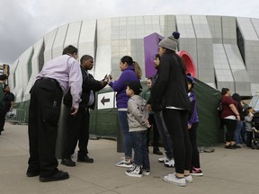 Security personnel check the tickets of people entering the Golden 1 Center to see the Kings play the New York Knicks in an NBA basketball game in Sacramento, Calif., Monday, March 4, 2019. Extra security has been added around the home of the Kings in the wake of Saturday's announcement by Sacramento County District Attorney Anne Marie Schubert Sacramento Police Officers Terrance Mercadal and Jared Robinet did not break any laws when they shot and killed Stephon Clark after the 22-year-old vandalism suspect ran from them into his grandparents backyard last year.