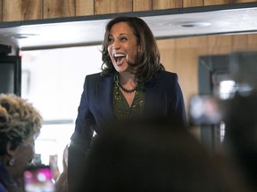 FILE - In this March 8, 2019, file photo, Sen. Kamala Harris, D-Calif.,meets with supporters at Big Mike's Soul Food, in Myrtle Beach, S.C. Harris is rolling out a slate of endorsements in the critical early primary state of South Carolina.