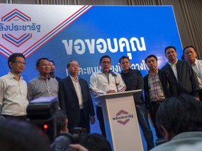 Phalang Pracharat party leader Uttama Savanayana (C) speaks during a press conference at the party headquarters on March 24, 2019 in Bangkok, Thailand. Around 50 million voters headed to the polls in Thailand on Sunday for the first general election since the country's military seized power in a 2014 coup.
