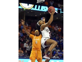Mississippi State's Anriel Howard (5) drives in for layup past Tennessee's Rennia Davis during the first half of an NCAA college basketball game at the Southeastern Conference women's tournament, Friday, March 8, 2019, in Greenville, S.C.