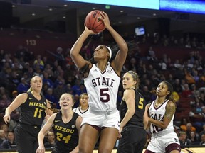 Mississippi State's Anriel Howard, center, shoots while defended by Missouri's Haley Troup (11) Jordan Chavis (24) and Lauren Aldridge during the first half of an NCAA college basketball game in the Southeastern Conference women's tournament Saturday, March 9, 2019, in Greenville, S.C.