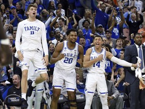 Duke's bench reacts to a play during the second half of the team's second-round men's college basketball game against Central Florida in the NCAA Tournament in Columbia, S.C. Sunday, March 24, 2019.