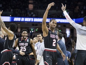 Gardner-Webb forward Eric Jamison Jr. (2) celebrates after a score against Virginia during a first-round game in the NCAA men's college basketball tournament Friday, March 22, 2019, in Columbia, S.C.