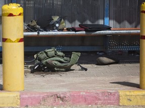 A vest of an Israeli soldier is seen on the ground at the scene of an attack near the West Bank Jewish settlement of Ariel, Sunday, March 17, 2019.The Israeli military says a Palestinian killed an Israeli and seriously wounded two others in a West Bank shooting and stabbing spree before fleeing and setting off a massive manhunt.