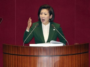 FILE - In this Tuesday, March 12, 2019, file photo, Na Kyung-won, the floor leader of the main opposition Liberty Korea Party, delivers a speech at the National Assembly in Seoul, South Korea. International journalists' organizations on Tuesday, March 19, 2019, have expressed concern over South Korea's press freedoms after the country's ruling party singled out a Bloomberg reporter over what it claimed was a "borderline treacherous" article insulting President Moon Jae-in, resulting in threats to the reporter's safety.