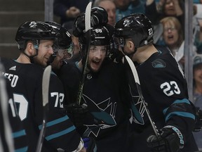 San Jose Sharks center Melker Karlsson, center, is congratulated by teammates after scoring a goal against the Florida Panthers during the first period of an NHL hockey game in San Jose, Calif., Thursday, March 14, 2019.