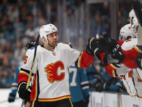 Calgary Flames' Dalton Prout (6) celebrates his goal with the bench against the San Jose Sharks in the first period of an NHL hockey game in San Jose, Calif., Sunday, March 31, 2019.