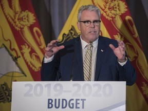 New Brunswick Finance Minister Ernie Steeves speaks at a press conference prior to delivering the provincial budget in the Legislature in Fredericton, New Brunswick on Tuesday, March 19, 2019.