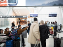 Travellers at Toronto's Pearson International Airport wait to see Air Canada staff following the Canadian government's decision to ground all Boeing 737 Max 8 aircraft from departing, arriving or flying over Canadian airspace, March 13, 2019.