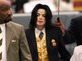 In this May 25, 2005 file photo, Michael Jackson arrives at the Santa Barbara County Courthouse for his child molestation trial in Santa Maria, Calif.
