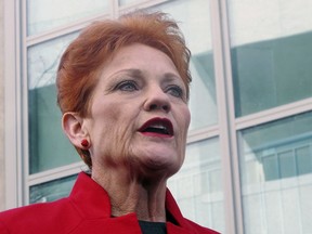 In this June 21, 2018, file photo One Nation party senator Pauline Hanson addresses the media at Parliament House in Canberra, Australia. Australia's Prime Minister Scott Morrison, on Tuesday, March 26, 2019, accused the One Nation party of trying to "sell Australia's gun laws to the highest bidders" by asking the U.S. gun lobby for donations.