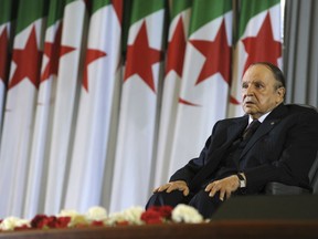 FILE - In this April 28, 2014 file photo, Algerian President Abdelaziz Bouteflika sits in a wheelchair after taking oath as President, in Algiers. Algeria's powerful army chief said Tuesday March 26, 2019 that he wants to trigger the constitutional process that would declare President Abdelaziz Bouteflika unfit for office, after more than a month of mass protests against the ailing leader's long rule.