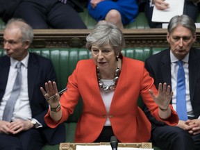 FILE - In this Tuesday March 12, 2019 file photo Britain's Prime Minister Theresa May speaks to lawmakers in parliament, London. Britain's love-hate relationship with the rest of Europe goes back decades, but the Brexit crisis gripping it today stems from dramatic January 2013 speech by Prime Minister David Cameron in which he promised an "in or out" referendum. Britain voted to leave, but negotiations between Britain and the EU have been slow and at times acrimonious, and the 585-page withdrawal agreement produced after two years of talks has been rejected twice by Britain's divided Parliament.