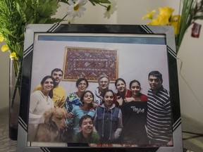 A family portrait is placed on a side table at the home of Manant Vaidya, who lost his two parents, sister, brother-in-law, and two young nieces in a Ethiopian Airlines plane crash in Brampton, Ont. on Monday, March 11, 2019.