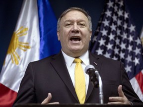 FILE - In this March 1, 2019, file photo, U.S. Secretary of State Mike Pompeo speaks during a news conference with Philippines Foreign Secretary Teodoro Locsin Jr. at the Philippines Department of Foreign Affairs Home Office in Manila, Philippines. The United States is more likely to be involved in a "shooting war" in the disputed South China Sea than the Philippines but the latter would be embroiled in such a conflict just the same because of its 1951 Mutual Defense Treaty with Washington, the Philippine defense chief said Tuesday, March 5, 2019.