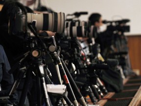 Cameramen stand by for a planned press conference by Chief Cabinet Minister Yoshihide Suga at prime minister's official residence in Tokyo Monday, April 1, 2019. Japanese government later Monday will unveil a new era name for soon-to-be-emperor Naruhito, who will succeed the Chrysanthemum throne from his father May 1.