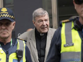 FILE - In this Feb. 26, 2019, file photo, Cardinal George Pell arrives at the County Court in Melbourne, Australia. The most senior Catholic to be convicted of child sex abuse will be sentenced to prison on Wednesday, March 13, 2019 in an Australia landmark case that has polarized observers. Some described the prosecution as proof the church is no longer above the law, while others suspect Cardinal George Pell has been made a scapegoat for the church's sins.