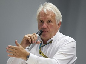 FILE - In this Oct. 10, 2014, file photo, Charlie Whiting, International Automobile Federation, or FIA, Race Director, gestures answering a question during a news conference at the 'Sochi Autodrom' Formula One circuit , in Sochi, Russia. The governing body for international auto racing says its Formula One director Whiting has died from a pulmonary embolism. He was 66. The FIA issued a statement Thursday, March 14, saying Whiting died in Melbourne, where the season-opening Australian Grand Prix will be raced on Sunday.