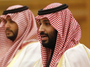 FILE - In this Feb. 22, 2019, file photo, Saudi Crown Prince Mohammad bin Salman, right, speaks to Chinese President Xi Jinping during a meeting at the Great Hall of the People in Beijing. Prosecutors in Saudi Arabia say they have referred detained women's rights activists to trial and that those charged "enjoy all rights preserved by the laws in the kingdom" after them being reportedly tortured in custody. Prosecutors issued the statement late Friday night, March 1, 2019, referring to their earlier June statement that announced the activists' arrest just before Saudi Arabia granted women the right to drive. Human rights groups have criticized the arrests, which come amid a series of crackdowns led by Saudi Crown Prince Mohammed bin Salman, the son of King Salman.