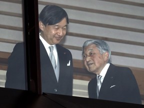 FILE - In this Dec. 23, 2018, file photo, Japan's Emperor Akihito, right, accompanied by Crown Prince Naruhito, walks away after greeting well-wishers when they appeared on the balcony of the Imperial Palace to mark the emperor's 85th birthday in Tokyo. What's in a name? Quite a lot if you're a Japanese citizen awaiting the official announcement Monday. April 1, 2019 of what the soon-to-be-installed new emperor's next era will be called. It's a proclamation that has happened only twice in nearly a century, and the new name will follow Emperor Naruhito, after his May 1 investiture, for the duration of his rule, attaching itself to much of what happens in Japan.