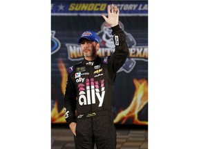 Jimmie Johnson (48) waves in victory lane after taking the pole position for the NASCAR Cup Series auto race at Texas Motor Speedway in Fort Worth, Texas, Friday, March 29, 2019.
