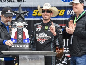 Driver Kyle Busch, center, celebrates in victory lane after winning a NASCAR auto race at Texas Motor Speedway, Saturday, March 30, 2019, in Fort Worth, Texas.