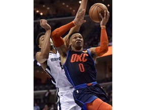Oklahoma City Thunder guard Russell Westbrook (0) shoots in front of Memphis Grizzlies forward Bruno Caboclo during the second half of an NBA basketball game Monday, March 25, 2019, in Memphis, Tenn.