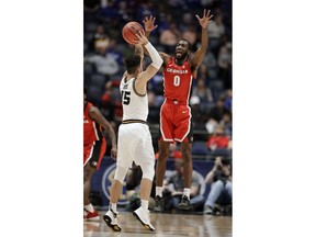 Georgia guard William Jackson II (0) defends against Missouri guard Jordan Geist (15) in the first half of an NCAA college basketball game at the Southeastern Conference tournament, Wednesday, March 13, 2019, in Nashville, Tenn.
