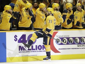 Nashville Predators left wing Viktor Arvidsson (33), of Sweden, is congratulated after scoring a goal against the Columbus Blue Jackets during the first period of an NHL hockey game Saturday, March 30, 2019, in Nashville, Tenn.