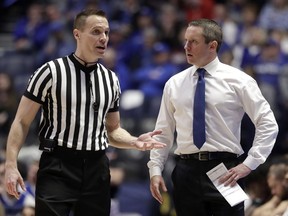 Florida head coach Mike White argues a call in the first half of an NCAA college basketball game against LSU at the Southeastern Conference tournament Friday, March 15, 2019, in Nashville, Tenn.
