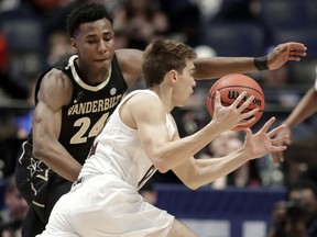 Texas A&M guard Chris Collins drives against Vanderbilt forward Aaron Nesmith (24) in the first half of an NCAA college basketball game at the Southeastern Conference tournament, Wednesday, March 13, 2019, in Nashville, Tenn.