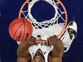 Mississippi State's Reggie Perry misses a dunk in the first half of an NCAA college basketball game against Texas A&M at the Southeastern Conference tournament Thursday, March 14, 2019, in Nashville, Tenn.