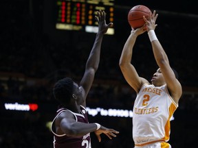 Tennessee forward Grant Williams (2) shoots over Mississippi State forward Abdul Ado (24) during the first half of an NCAA college basketball game Tuesday, March 5, 2019, in Knoxville, Tenn.