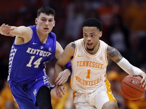 Tennessee guard Lamonte Turner (1) drives against Kentucky guard Tyler Herro (14) during the second half of an NCAA college basketball game Saturday, March 2, 2019, in Knoxville, Tenn. Tennessee won 71-52.