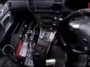 This image taken from the alleged shooter's video, which was filmed Friday, March 15, 2019, guns on the passenger side of his vehicle in New Zealand. A witness says many people have been killed in a mass shooting at a mosque in the New Zealand city of Christchurch. Police have not described the scale of the shooting but urged people to stay indoors. (AP Photo)