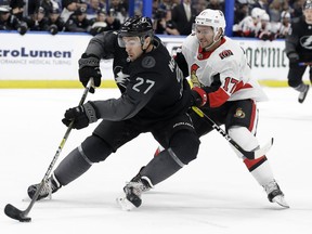 Tampa Bay Lightning defenseman Ryan McDonagh (27) cuts in front of Ottawa Senators left wing Brian Gibbons (17) during the first period of an NHL hockey game Saturday, March 2, 2019, in Tampa, Fla.