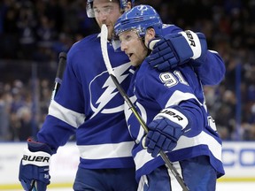 Tampa Bay Lightning center Steven Stamkos (91) celebrates his goal against the Winnipeg Jets with defenseman Victor Hedman (77) during the second period of an NHL hockey game Tuesday, March 5, 2019, in Tampa, Fla.