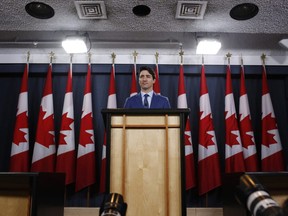 Justin Trudeau, Canada's prime minister, listens during a news conference at the National Press Theatre in Ottawa, Ontario, Canada, on Thursday, March 7, 2019. Trudeau acknowledged there was an "erosion of trust" between his office and his former attorney-general over SNC-Lavalin Group Inc., though she never came to him directly to express her concerns about aiding the embattled construction firm.