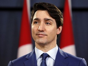 Prime Minister Justin Trudeau listens to a reporter during a news conference at the National Press Theatre in Ottawa, Ontario, Canada, on Thursday, March 7, 2019.