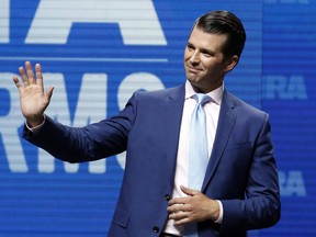 In this May 4, 2018, file photo, Donald Trump Jr., waves from the stage at the National Rifle Association in Dallas.