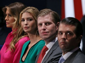This October 9, 2016 file photo shows family members of President Donald Trump, (from L-R) wife Melania Trump, daughter Ivanka Trump, and sons Eric Trump and Donald Trump Jr.as they listen to the second presidential debate at Washington University in St. Louis, Missouri.