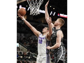 Sacramento Kings' Nemanja Bjelica (88) attempts to shoot against San Antonio Spurs' Davis Bertans during the first half of an NBA basketball game, Sunday, March 31, 2019, in San Antonio.