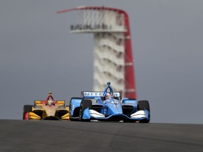 Felix Rosenqvist (10), of Sweden, and Ryan Hunter-Reay (28), of United States, steer through a turn during an open practice session for the IndyCar Classic auto race, Saturday, March 23, 2019, in Austin, Texas.