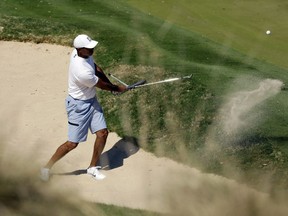 Tiger Woods plays a shot from a bunker on the 17th hole during a practice round at the Dell Match Play Championship golf tournament, Tuesday, March 26, 2019, in Austin, Texas.