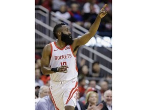 Houston Rockets guard James Harden reacts after making a three point basket during the first half of an NBA basketball game against the Sacramento Kings, Saturday, March 30, 2019, in Houston.