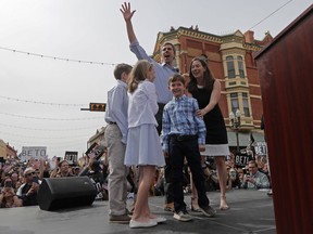 Democratic presidential candidate and former Texas congressman Beto O'Rourke acknowledges the crowd as he arrives on stage with his family at his presidential campaign kickoff in El Paso, Texas, Saturday, March 30, 2019. With him are his wife, Amy, and their children, Ulysses, 12, left; Molly, 10, center, and son Henry, 8.
