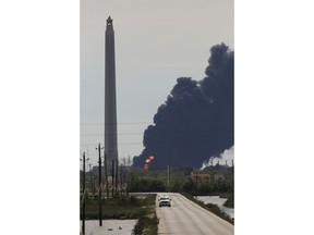 A view of the petrochemical fire at the Intercontinental Terminals Company, which is less than two miles southwest of the San Jacinto Memorial Monday, March 18, 2019, in Baytown, Texas. The large fire at a Houston-area petrochemicals terminal will likely burn for another two days, authorities said Monday, noting that air quality around the facility was testing within normal guidelines.