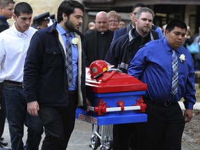 In this Dec. 28, 2017, photo pallbearers carry the firefighter-themed casket of six-year-old Kameron Prescott after a church service in Schertz, Texas. Four Texas sheriff's deputies won't face charges for opening fire on a suspected car thief, killing her and Prescott who they didn't know was nearby, according to a grand jury's decision this week.