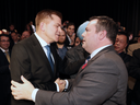 Jason Kenney, right, shakes hands with rival Brian Jean after it was announced that Kenney was elected leader of the United Conservative Party on Oct. 28, 2017.