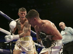 Charlie Edwards, left, fights against Angel Moreno in their World Boxing Council World Flyweight Title bout at the Copper Box Arena, London.